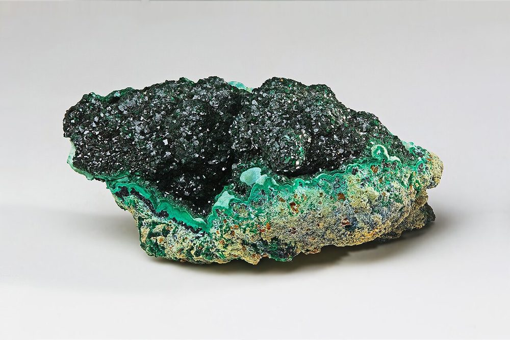 Malachite peacock stone — a vivid green copper carbonate surface indicator
